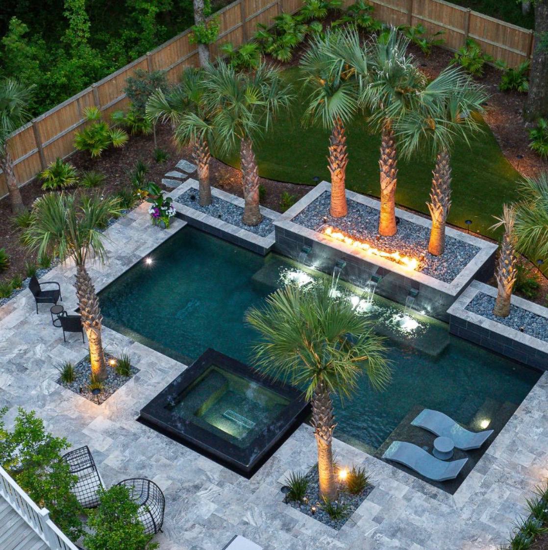 Pool with palm trees and fire features